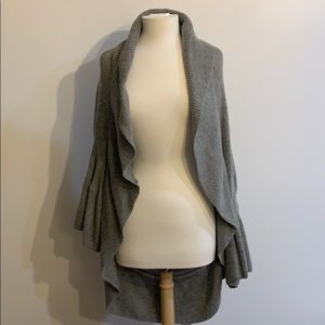 Anthropologie gray cardigan with large ruffles.